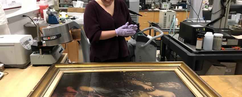 Caroline Longo, students in Suzanne Deal Booth Seminar "The Material Science of Art," prepares to use x-radiography to examine The Penitent St. Jerome at the Smart Museum of Art.