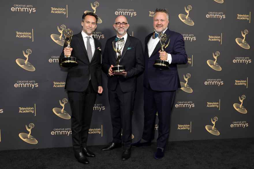 From left: Production designer Curt Beech, art director Jordan Jacobs, and Rich Murray, AB'94, with their Emmys for "Only Murders in the Building." (Amy Sussman/Getty Images Entertainment via Getty Images)