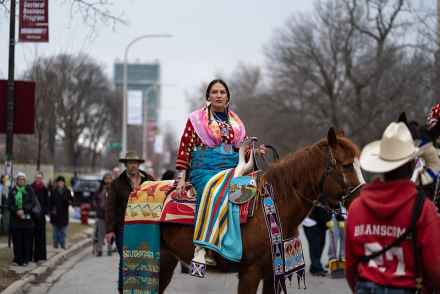 Curator Nina Sanders, a visiting fellow at the Neubauer Collegium, sits on horseback at a parade to open Apsáalooke Women and Warriors on March 12, 2020. The exhibition grew out of the Open Fields research project, one of 111 faculty-led collaborations the Neubauer Collegium has supported since its 2012 launch. Photo by Max Herman.