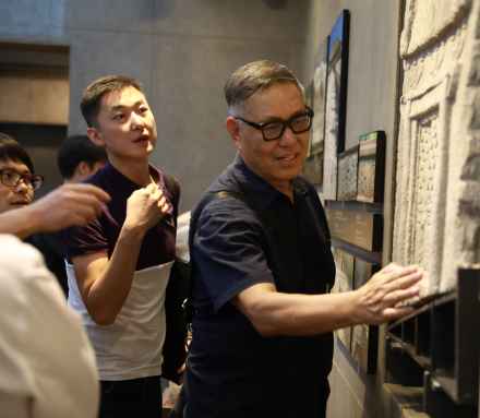 Wu Hung shows students details of a sculptural relief. Published in 2020, his award-winning book "First Class" uses 24 of his opening class lectures to illustrate how he structures the study of Chinese art history.